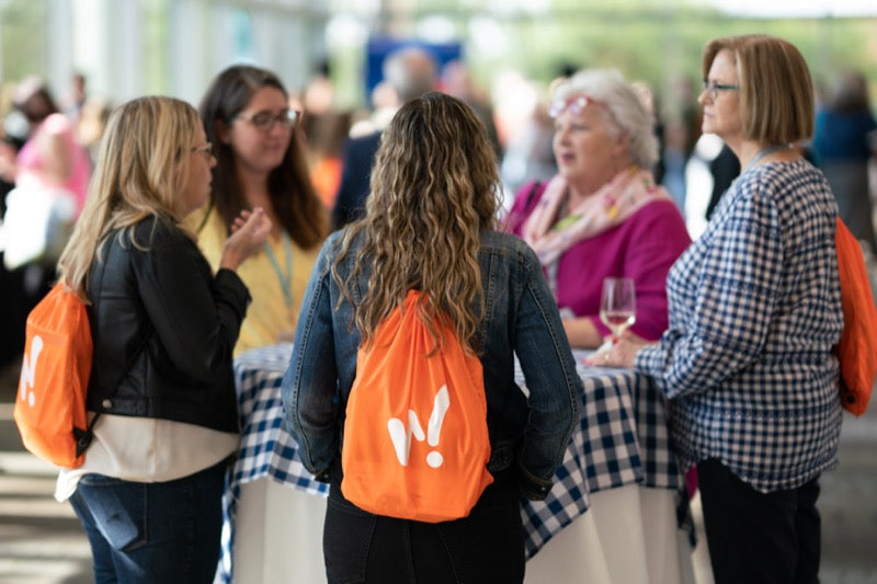 Retailers networking at the retail success summit in the Devos Place atrium in Grand Rapids, MI